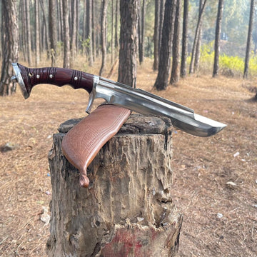 Knife with a wooden handle and brown leather sheath on a tree stump in a forest for camping and protection